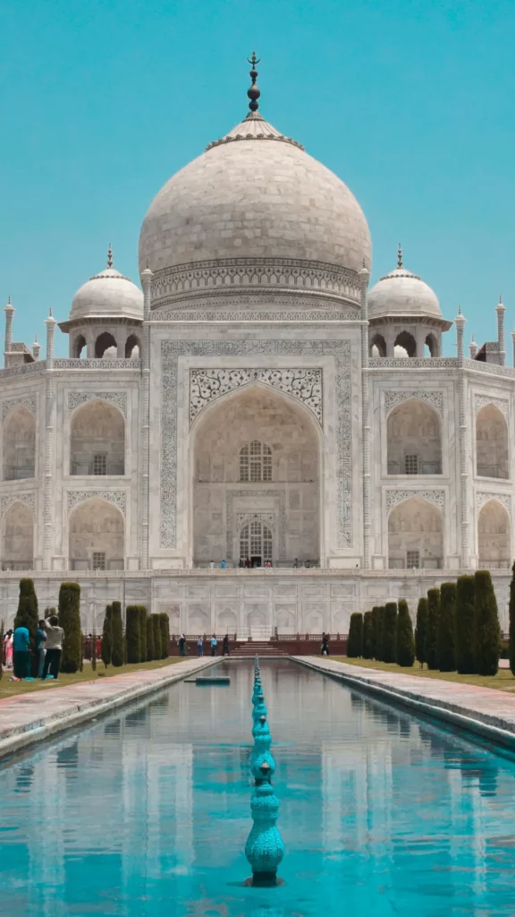 Which empire is renowned for its exceptional contributions to architecture, notably for the construction of the Taj Mahal?